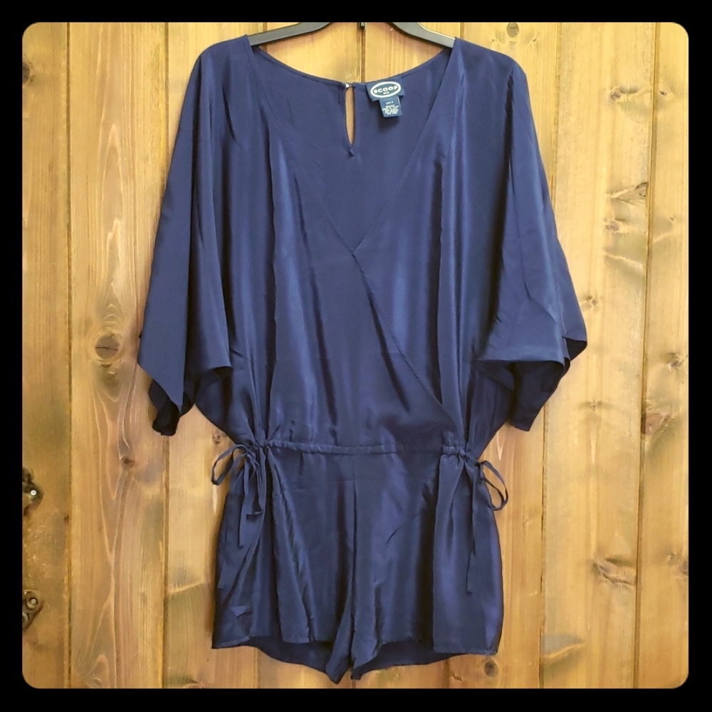 Silk v neck short jumpsuit with side drawstrings.